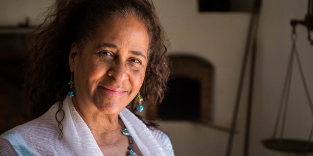 ZSun-nee Miller-Matema poses for a portrait at Mount Vernon in July. Miller-Matema is a descendant of Caroline Branham, one of George Washington's slaves who served as former first lady Martha Washington's personal maid.