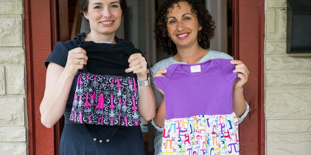 Eva St. Clair, left, and Rebecca Melsky pose for a portrait at Melsky's home in Washington. Melsky and St. Clair design dresses for Princess Awesome, a girls' clothing line that uses traditional boys' motifs such as trains, dinosaurs, ninjas, and planes.