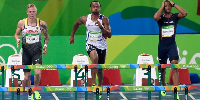 France's Wilhem Belocian, right, reacts after being disqualified.