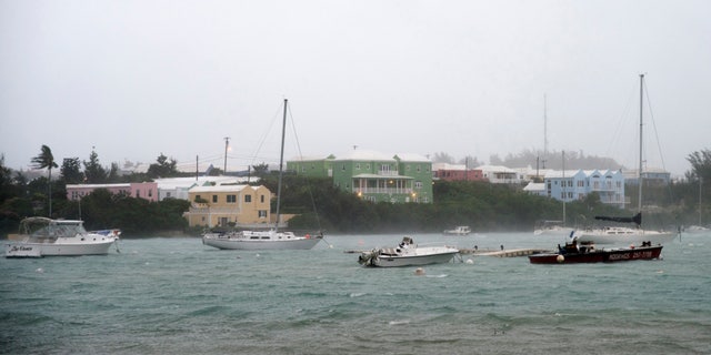 Heavy rain and strong winds rock boats moored in Mullet Bay in St. Georges, Bermuda, on Thursday.