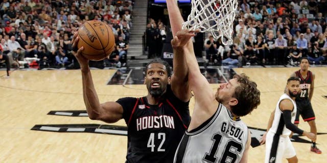 Houston Rockets center Nene Hilario (42) goes up for a shot as San Antonio Spurs' Pau Gasol (16) of Spain defends during the second half of Game 2 in a second-round NBA playoff series basketball game, Wednesday, May 3, 2017, in San Antonio. (AP Photo/Eric Gay)