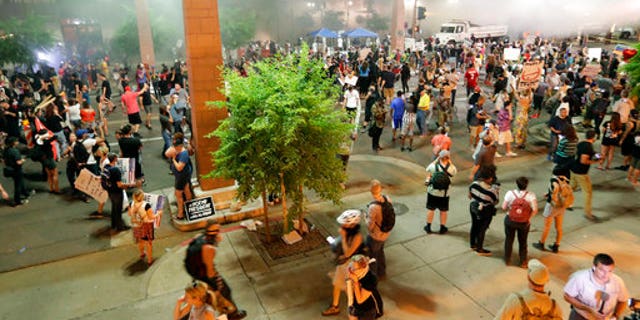 Protesters outside the Phoenix Convention Center on Tuesday.