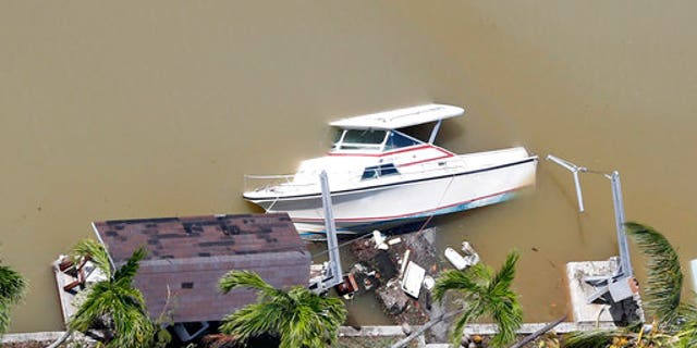 A boat is partially submerged in Key Largo, Florida, after Hurricane Irma.