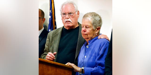 John Lyon hugs his wife, Mary, right, after a plea by Lloyd Lee Welch Jr., for the killings of their daughters Sheila and Katherine Lyon in 1975.
