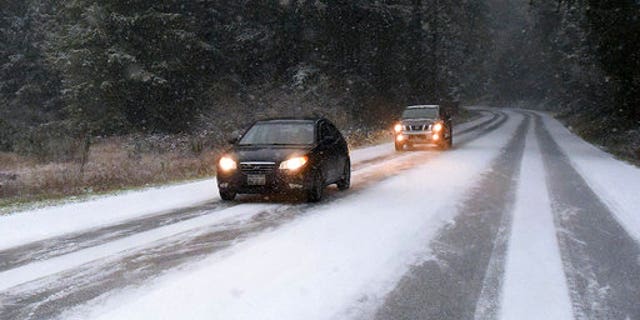 Snow on the road near Yelm, Wash., on Sunday.