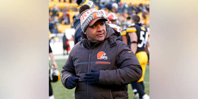 Cleveland Browns head coach Hue Jackson walking off the field after the game.