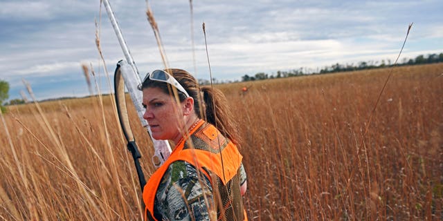 Jen Schaeffer, of Sioux Falls, walks a piece of cover during the South Dakota pheasant hunting opener.
