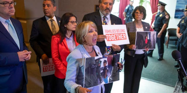 Rep. Michelle Lujan Grisham, center, and other Democratic lawmakers shouted at Trump.