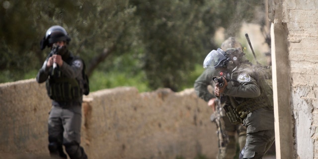 Israeli border police officers in the Palestinian village of Duma near the West Bank on Sunday.