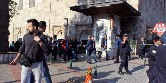 Security officials secure the area after an explosion outside the historical Ulu Cami in Bursa, Turkey, Wednesday, April 27, 2016. Turkish officials say a suicide attack has hit the northwestern city of Bursa, a popular tourist destination. A security official told The Associated Press the attack Wednesday was carried out by suicide bomber. (IHA agency via AP ) TURKEY OUT