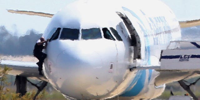 Local media reported a crew member escaped the jet through a cockpit window.