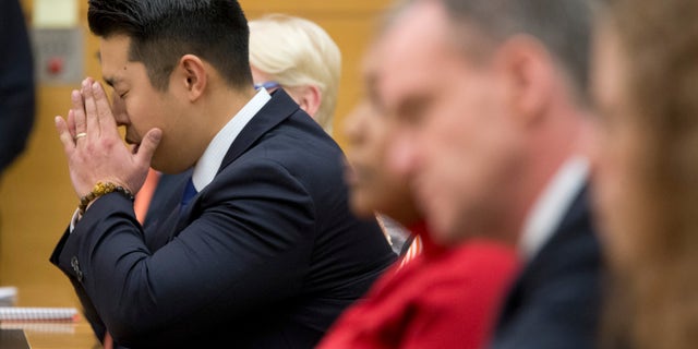 Police officer Peter Liang reacts as the verdict is read during his trial on charges in the shooting death of Akai Gurley, Thursday, Feb. 11, 2016 at Brooklyn Supreme court in New York in New York. (AP Photo/Mary Altaffer, Pool)