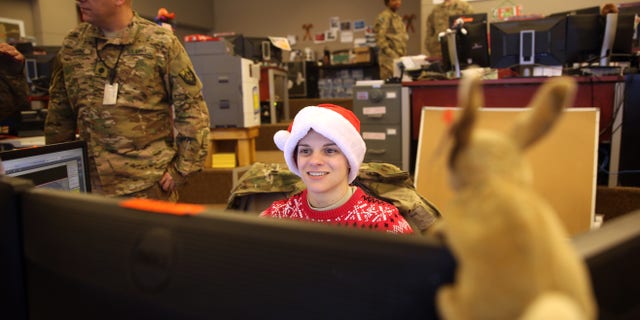 U.S. soldiers work in their office on Christmas day at Bagram Air Field, north of Kabul, Afghanistan, Friday, Dec. 25, 2015. (AP Photo/Massoud Hossaini)