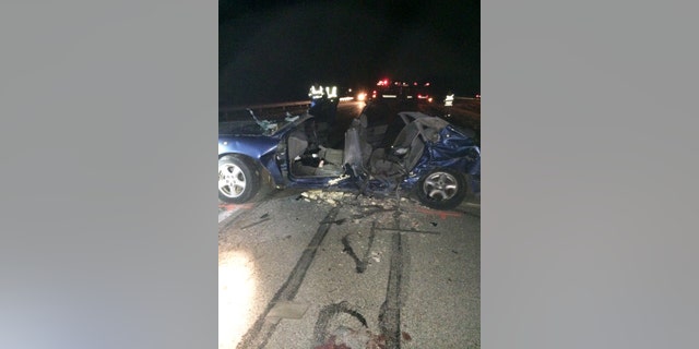 A photo provided by the Indiana State Police shows a Ford Taurus involved in a crash in Waverly, Ind., Wednesday evening that killed four Brownsburg, Ind. teenagers. The four died Wednesday evening when their car crossed a median on a state highway near Indianapolis and struck a minivan, Indiana State Police said. FIve others, including a fifth passenger in the Taurus and a family of four in the minivan, were taken to a hospital for treatment, police said. (Indiana State Police via AP)