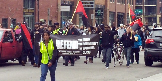 Protesters marched in Minneapolis on Saturday demanding prosecution of two officers in the Jamar Clark case.