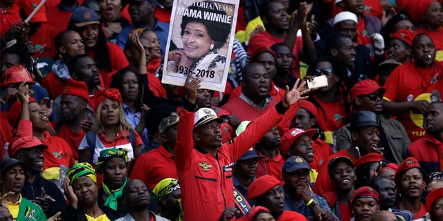Tens of thousands of people sang, cheered and cried as the flag-draped casket of anti-apartheid activist Winnie Madikizela-Mandela was escorted from her official funeral on Saturday.