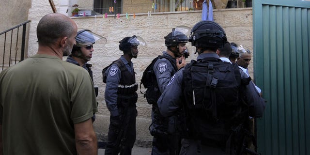 Sept. 30, 2014: Israeli police officers guard the house of Ziad Qarain, that Jewish settlers moved into, at the Palestinian neighborhood of Silwan, East Jerusalem