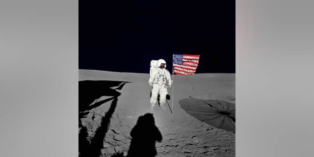 File photo - Astronaut Edgar Mitchell, Apollo 14 lunar module pilot stands by the U.S. flag on the lunar surface during the early moments of the mission's first spacewalk. He was photographed by astronaut Alan Shepard, mission commander. (NASA)