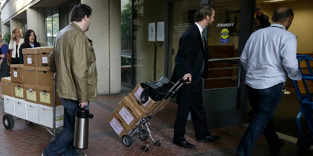 April 29, 2014: Boxes containing documents related to the Apple Inc. v. Samsung case are taken into a federal courthouse in San Jose, Calif.