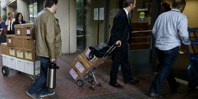 April 29, 2014: Boxes containing documents related to the Apple Inc. v. Samsung case are taken into a federal courthouse in San Jose, Calif.