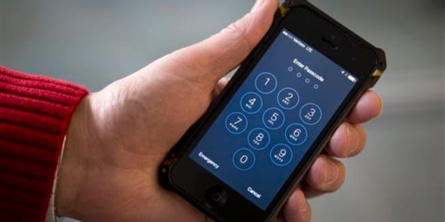 An iPhone is seen in Washington, Wednesday, Feb. 17, 2016. (AP Photo/Carolyn Kaster)
