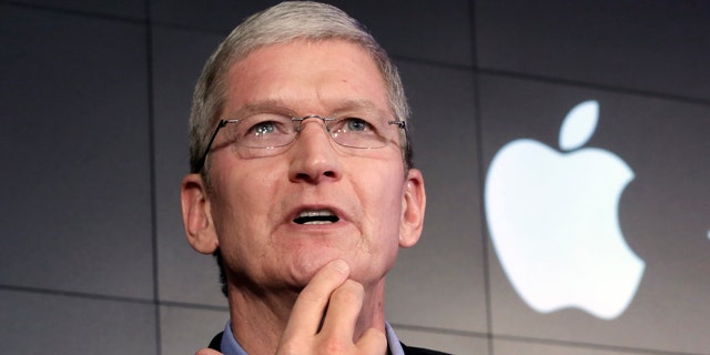 File photo - Apple CEO Tim Cook responds to a question during a news conference at IBM Watson headquarters, in New York, Thursday, April 30, 2015. (AP Photo/Richard Drew)