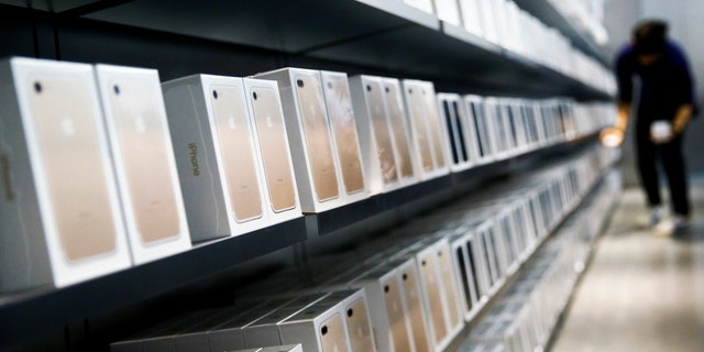 Apple's new iPhone 7 smartphones sit on a shelf at an Apple store in Beijing, China, Sept. 16, 2016. (REUTERS/Thomas Peter)