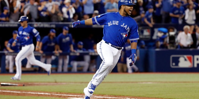 Oct. 18, 2016: Toronto Blue Jays' Edwin Encarnacion celebrates after his two-RBI double against the Cleveland Indians during the seventh inning in Game 4 of baseball's American League Championship Series in Toronto.