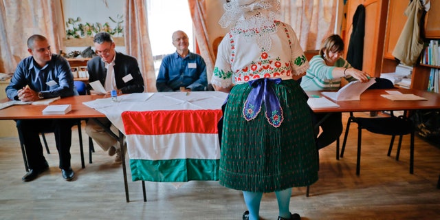 Edit Piros votes in a referendum in Hungary on Sunday.