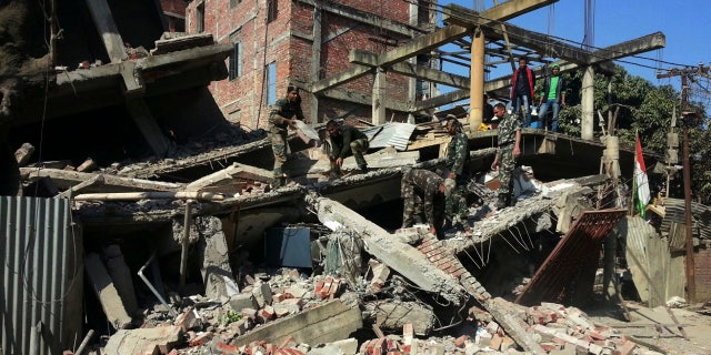 Jan. 4, 2016: Indian soldiers remove debris from a house that collapsed in an earthquake in Imphal, capital of the northeastern state of Manipur. (AP Photo/Worshon Ngashangva)