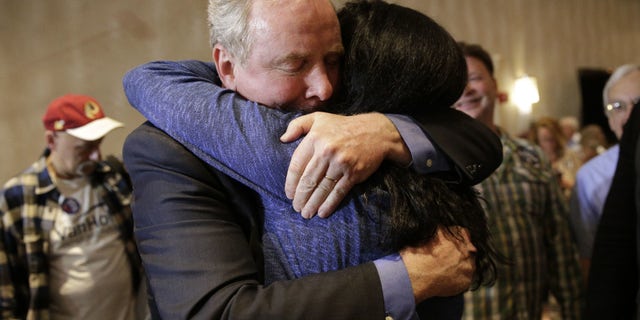 April 26, 2016: Democratic U.S. Senate candidate, Rep. Chris Van Hollen, D-Md., left, embraces supporter Carole Price after an election night party in Bethesda, Md.,