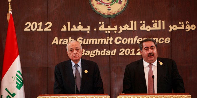 March 28, 2012: Arab League Secretary General Nabil Elaraby, left, and Iraqi Foreign Minister Hoshyar Zebari, right, hold a joint press conference in Baghdad, Iraq.