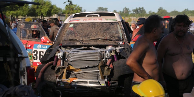 China's Guo Meiling's, X-Raid Team's damaged Mini, is seen after an accident in which at least 8 spectators were injured, during the Buenos Aires-Rosario prologue stage of the Dakar Rally 2016, in Arrecifes, Argentina, Saturday, Jan. 2, 2016. Guo Meiling is the first Chinese female driver to participate in the rally. (AP Photo/Jorge Saenz)