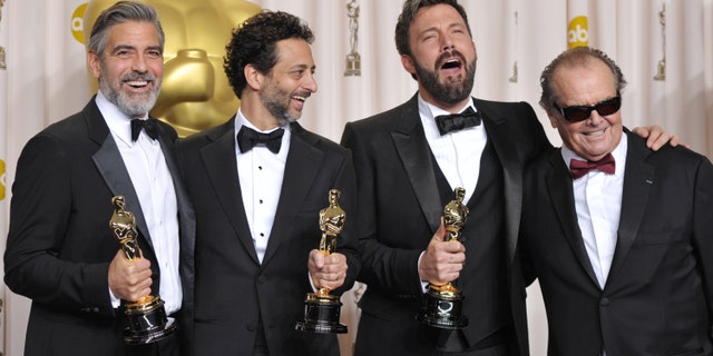 George Clooney, from left, Grant Heslov, Ben Affleck pose with their award for best picture for "Argo" pose with presenter Jack Nicholson, right, during the Oscars at the Dolby Theatre on Sunday Feb. 24, 2013, in Los Angeles. (Photo by John Shearer/Invision/AP)