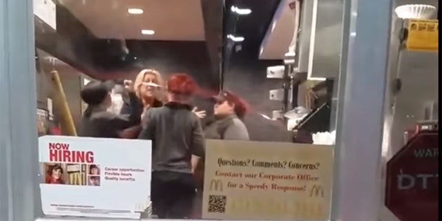 A bizarre altercation involving several employees inside a McDonald's was caught on camera in a now-viral video by a customer while he was waiting for his food.