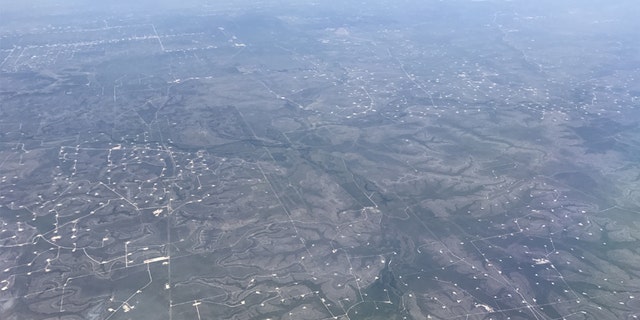 Aerial view of oil wells seen near Midland, Texas, U.S., May 2, 2017. Picture taken May 2, 2017. REUTERS/Ernest Scheyder - RC1366764970