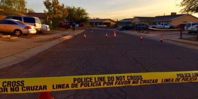 Crime scene tape outside the home where a 19-year-old pregnant woman was shot dead.