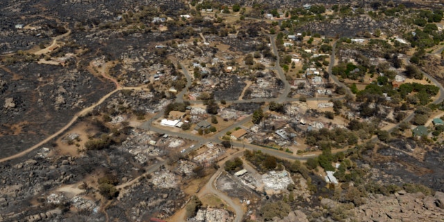 July 7, 2013: Several homes are seen destroyed by fire in Yarnell, Ariz.