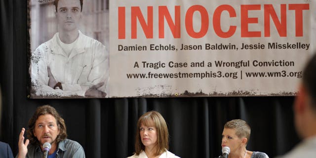 Singer Eddie Vedder, left, Lori Davis, center, wife of Damien Echols, and singer Natalie Maines, right, participate in a news conference Saturday, Aug. 28, 2010, before the "Voices for Justice" concert in Little Rock, Ark. Supporters of the "West Memphis Three" argue there were two sets of victims from the May 5, 1993 crime: the three murdered 8-year-olds and Damien Echols, Jason Baldwin and Jessie Misskelley, the then-teenagers who defenders claim were wrongly convicted in the deaths.