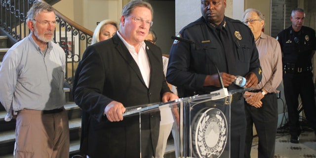 Little Rock Mayor Mark Stodola speaks at a news conference next to Police Chief Kenton Buckner in Little Rock, Ark. on Saturday, July 1, 2017 about an early morning shooting at a night club that left at least 28 people injured. (AP Photo/Andrew DeMillo)