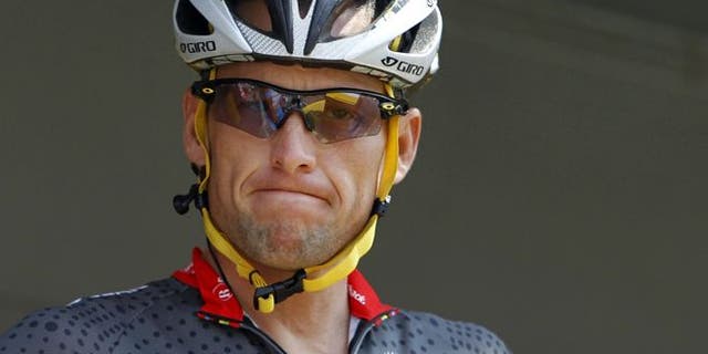 July 6, 2010: Lance Armstrong grimaces prior to the start of the third stage of the Tour de France cycling race in Wanze, Belgium.