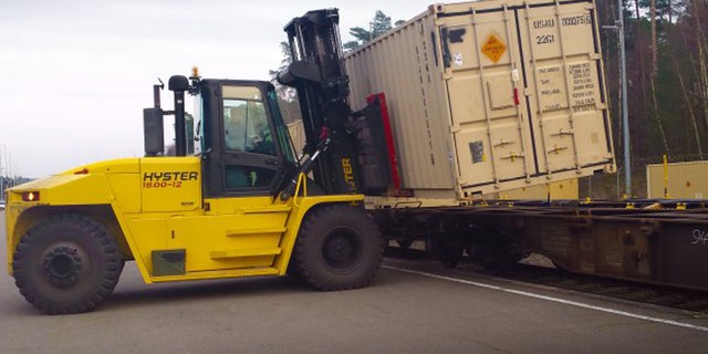 Werner Staab, a heavy equipment operator with the Theater Logistics Support Center-Europe's ammunition center, uses a forklift to offload cargo containers full of ammunition from a train at Miesau Depot in Germany.