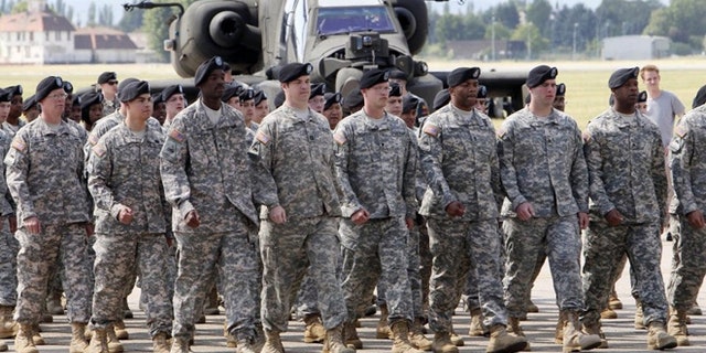 The black beret, seen above, was shelved in 2011 as the official headgear for the Army Combat Uniform. Now some soldiers want the right to roll up their sleeves, particularly during summer months in warm climates. (AP)