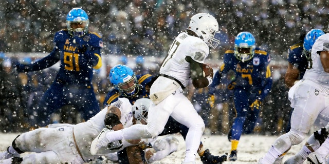 Army quarterback Ahmad Bradshaw runs the ball against Navy during the first half of Saturday's Army-Navy game in Philadelphia