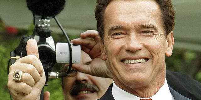 California Gov. Arnold Schwarzenegger gives a thumbs-up after voting at a polling place at a home in Los Angeles' Brentwood district Tuesday, Nov. 8, 2005. (AP Photo/Reed Saxon)