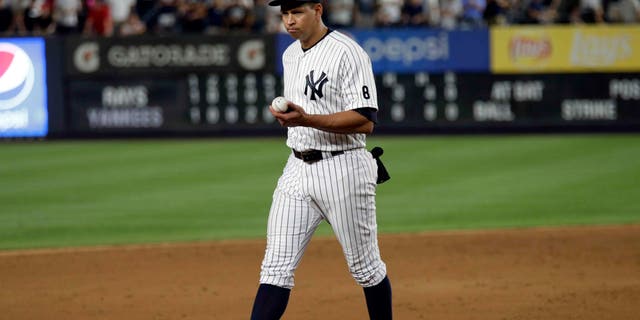 Alex Rodriguez walks towards third base in his final game as a Yankee player, Friday, Aug. 12, 2016, in New York.
