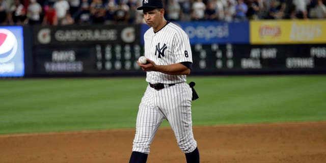 Alex Rodriguez walks towards third base in his final game as a Yankee player, Friday, Aug. 12, 2016, in New York.