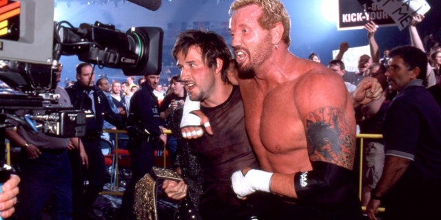 David Arquette poses with pro wrestler Diamond Dallas Page.