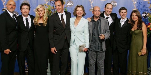 The Cast of "Arrested Development" smile at the 56th annual Primetime Emmy Awards in Los Angeles, September 19, 2004.