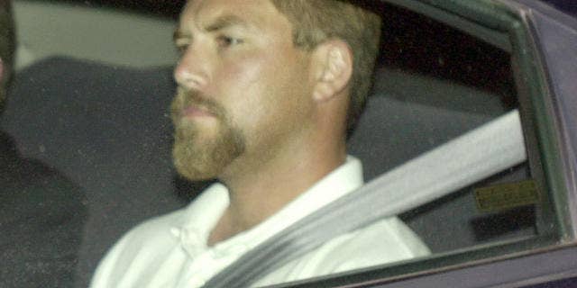 Scott Peterson arrives at county jail after being charged with murdering his wife and unborn child in April 2003.